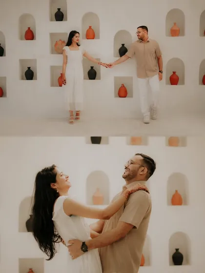 A collage showing a couple's playful and romantic moments against a clean, white set with decorative pots, reminiscent of a Santorini vibe.