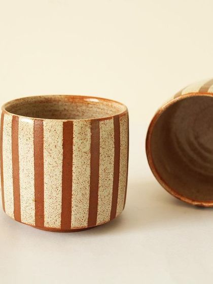My Coffee Drip cups feature a rustic, speckled finish with clean, hand-painted sienna stripes. They have a sturdy, straight-sided form, ideal for a generous serving of coffee or tea.