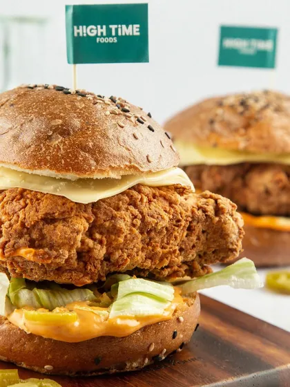 A tighter, more detailed shot of the vegan burger. This angle emphasizes the crispy texture of the patty and the fresh ingredients, making it look substantial and delicious.