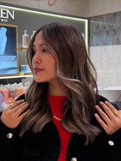 My signature balayage on a shorter, textured lob. This technique isn't just for long hair; it adds incredible dimension and the illusion of thickness to medium length cuts, finished here with soft waves.
