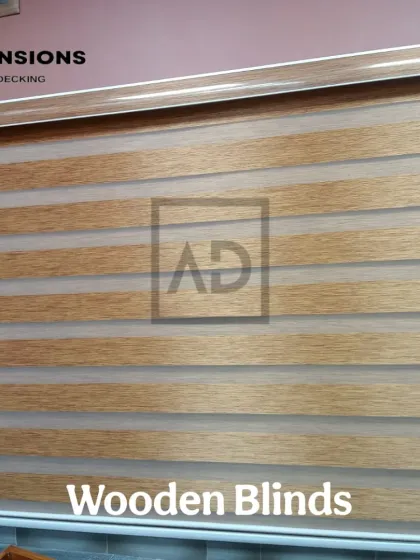 A close-up view of a wooden-style zebra blind. You can see the alternating sheer and solid panels that give you complete control over how much light enters the room, creating a modern, striped effect.