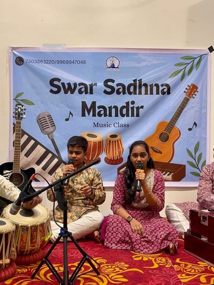 A young duo performing together at our Guru Purnima Utsav. Learning to sing in sync with another person is a great skill, and they are doing it beautifully.
