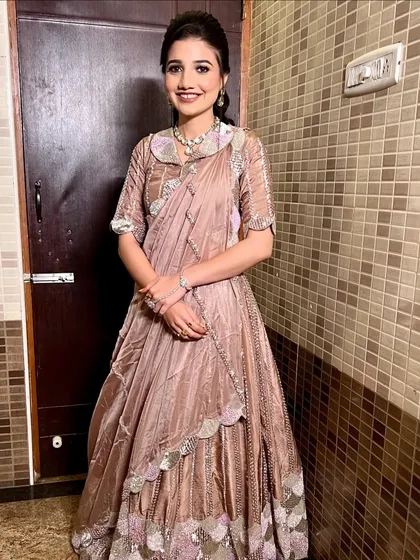 A full-length shot of the bride, showcasing her unique and stylish sangeet outfit.