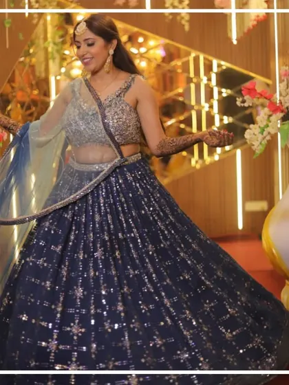 A full, twirling shot of the beautiful blue mehndi lehenga.