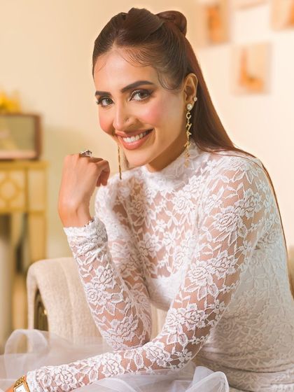 A happy and smiling shot, showing the versatility of the makeup for both serious and joyful expressions.