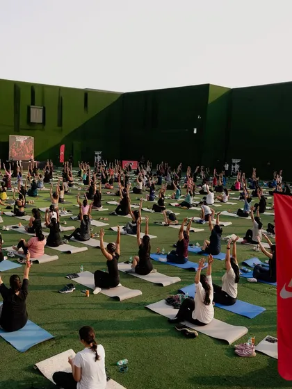 A wide shot of our outdoor yoga session. Seeing a field of people moving in unison is a beautiful sight.