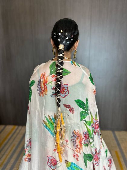 A unique Mehendi braid featuring intricate gota patti weaving and custom-made latkans with tassels for a personalized touch.