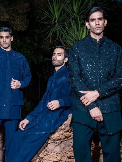 Three models present a formidable collection of our dark-toned Indo-Western ensembles. From shimmering sequins to subtle textures, each piece is designed to make a powerful statement at evening celebrations.