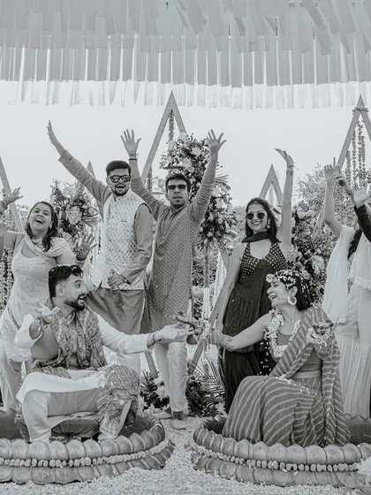 A fun black and white group photo from a Haldi ceremony, capturing the collective energy and joy of the "haldi squad."