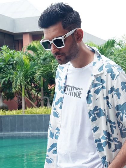 Posing by the pool before a Haldi event in Goa. The outfit has to match the cool, breezy vibe of the location.