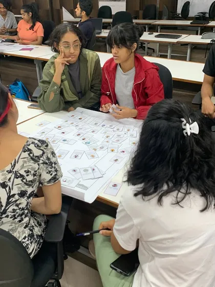 Students engaged in a gamified session to test our Restoration Toolbox. Using card games and interactive boards makes learning about the complexities of heritage conservation engaging and memorable.