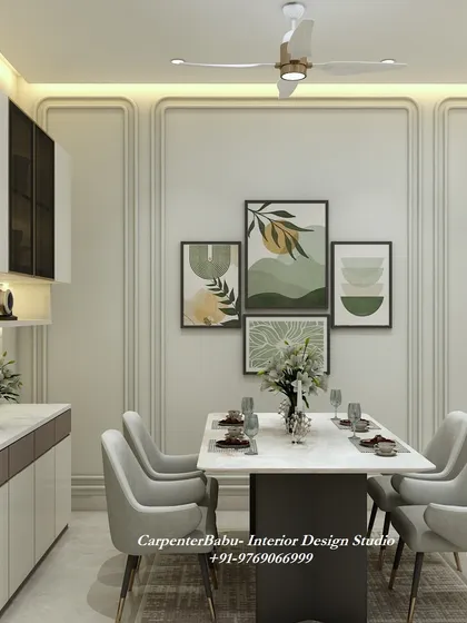 A dining area set against a paneled wall with a gallery of nature-inspired art prints. The design is fresh, modern, and brings the outdoors in.