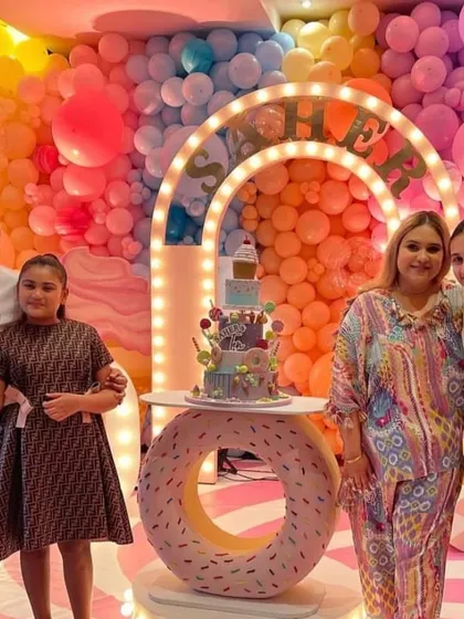 Our custom props make any theme possible. This unique donut-shaped LED cake table was the centerpiece for a fun candy-themed birthday party, creating a sweet memory for the whole family.