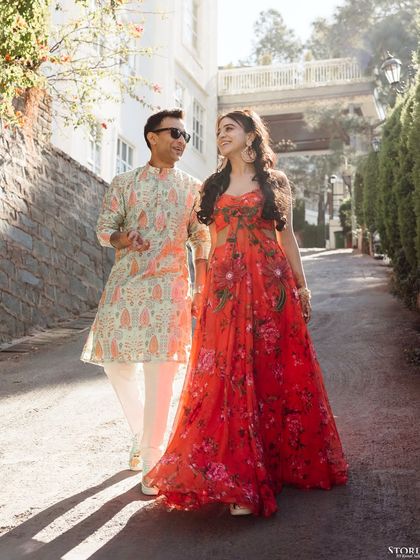 Mohit and Ankurita walking down a sunlit path, their casual and happy interaction making for a perfect pre-wedding shot.