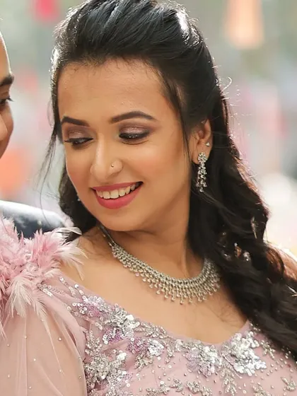 When I make my clients smile, that's real success. A beautiful candid shot of a happy client at a wedding event.