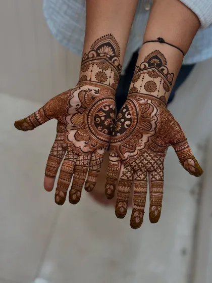 This design is so bold and beautiful. The central mandala is perfectly executed, and the surrounding patterns complement it so well. It’s a testament to the student's growing confidence.