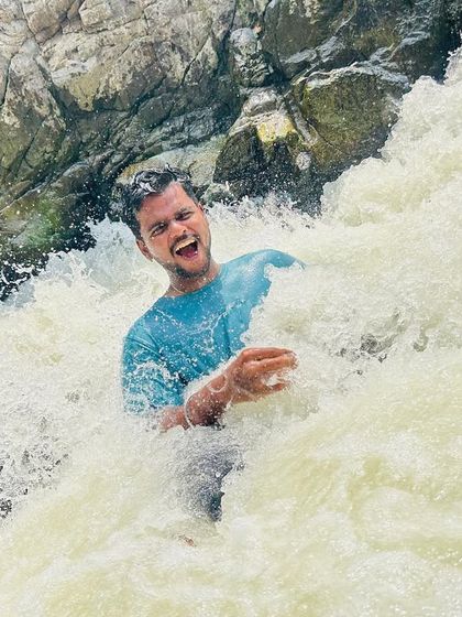 Another shot of enjoying the natural shower at Hogenakkal Falls. A must-do activity when you visit.