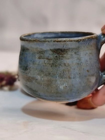 A close-up of my ceramic glazed espresso cup. This small 100ml mug is perfect for your favorite coffee or tea and is available in a set of two.
