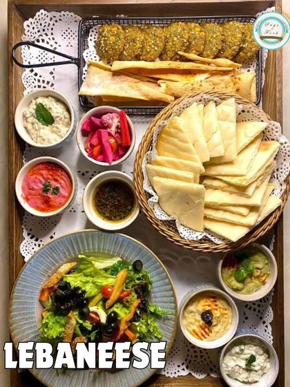 A beautiful platter showcasing our Lebanese cuisine. This Mezze Platter is a complete meal with falafel, pita, various dips, and a fresh salad.