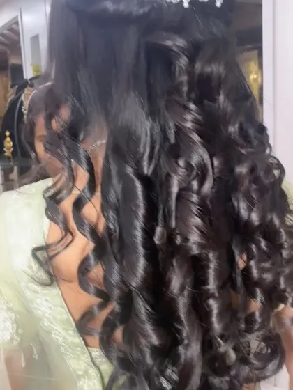 This is the back view of the Sagan hairstyle, showing the voluminous, bouncy curls. I use professional techniques to ensure your curls hold their shape and look perfect from every angle throughout the event.
