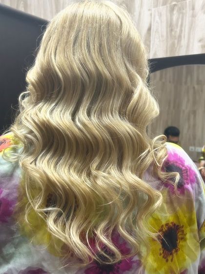 Classic Hollywood waves on blonde hair, showing the beautiful S-curve pattern that defines this glamorous style.