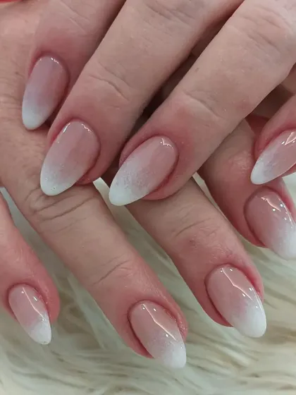 The classic baby boomer ombré on almond nails is a timeless choice for any bride seeking simple elegance.