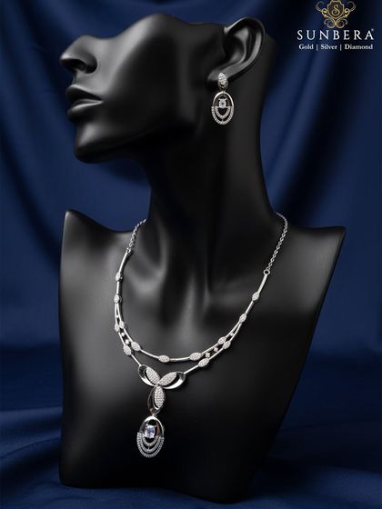 An elegant 925 sterling silver necklace and earring set displayed on a mannequin. The design features a double chain and a floral pendant, showcasing a premium finish that is ideal for resale.