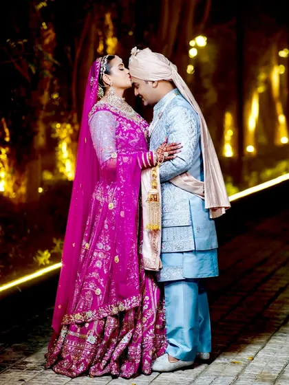 Another angle of the romantic forehead kiss.