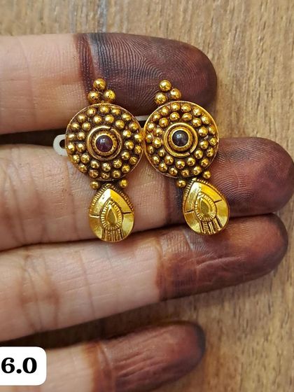 These antique silver gold-plated earrings are small and lightweight, perfect for daily wear. This pair features a circular design with a central stone and a small drop.