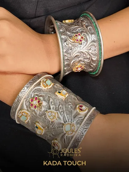 The Kada Touch. These handcrafted oxidized silver kadas feature detailed floral carvings and gemstone inlays, perfect for stacking or wearing as a single statement piece.