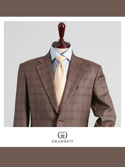 This brown plaid suit jacket is a statement of refined taste. The pattern adds visual interest while the classic cut keeps it appropriate for professional environments.