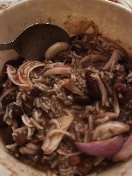 A hearty bowl of rajma chawal (kidney beans and rice) with onions. Comfort food can absolutely be part of a healthy diet.