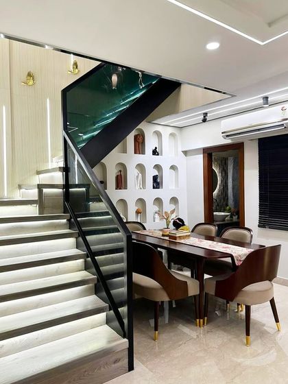 Here is a complete view of a client's home in Gurgaon, featuring my custom dining set. The table and chairs are perfectly integrated into the home's modern architecture, nestled beautifully by the staircase.