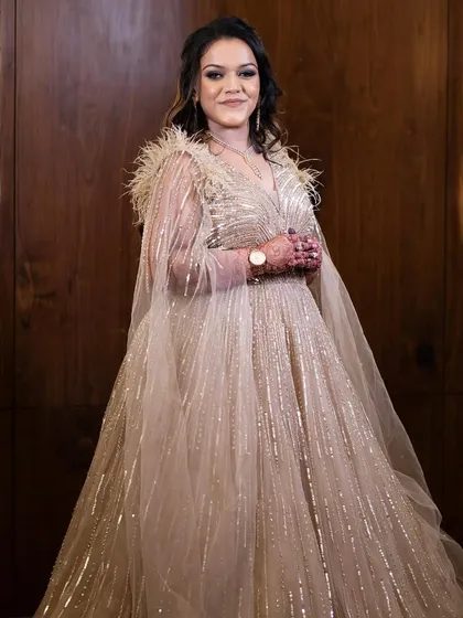 Still not over this stunning, dreamy outfit. The soft glam makeup with a shimmery gown and feather detailing is pure elegance.