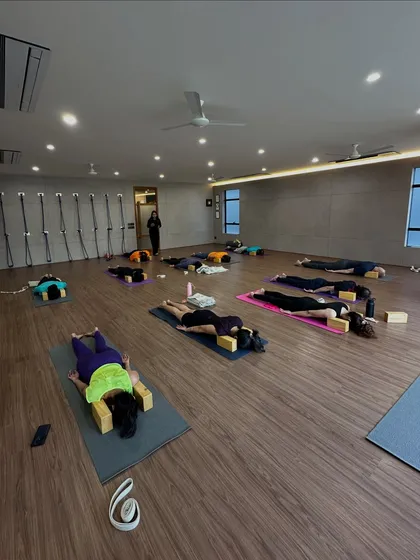 A restorative session at the end of a workshop. We used blocks to support the body in a gentle backbend, allowing for deep release and rest.