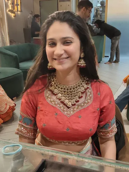 The smile says it all! We love helping our clients find the jewellery that makes them feel beautiful and confident. This is a snapshot from a happy trial session at our Delhi store.
