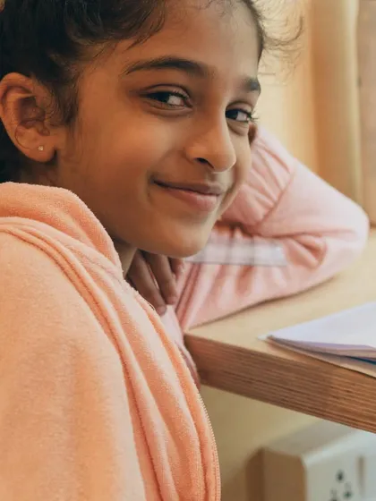 A quiet moment of creativity. Samara finds her focus at our hub, demonstrating the calm and concentration that art can inspire.