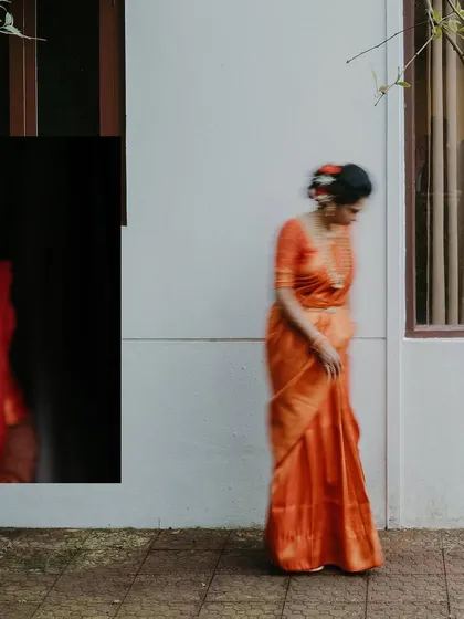 An artistic bridal portrait using motion blur. This technique creates a dreamy, ethereal quality, focusing on the color and form of the bride's attire.
