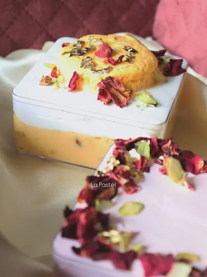 A close-up of the Rasmalai Tres Leches tub, showing the rich, creamy texture and the beautiful toppings.