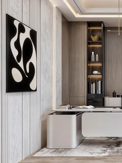 This view of the office highlights the abstract art and the fluted marble wall, adding texture and artistic flair to the corporate space.