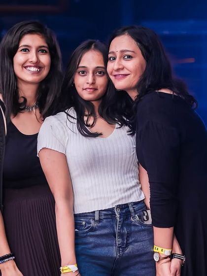 Guests enjoying the Ethnic Day party at Sunburn. The smiles on their faces show that a great theme can make a party even more special.