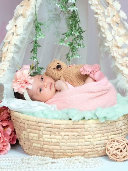 This little one is awake and looking right at the camera. It’s a special moment when we capture their beautiful, curious eyes.