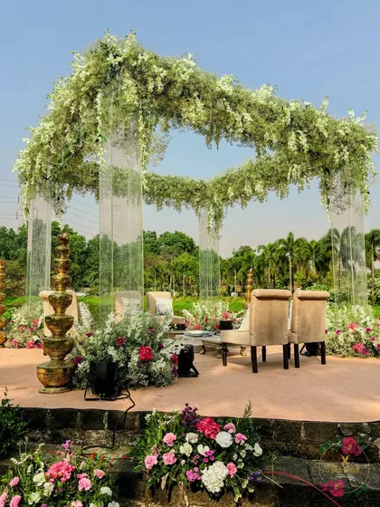 I love creating modern fairy tales. This mandap uses elegant acrylic pillars and a floating ceiling of white wisteria, creating a dreamy, ethereal space for a lakeside ceremony.