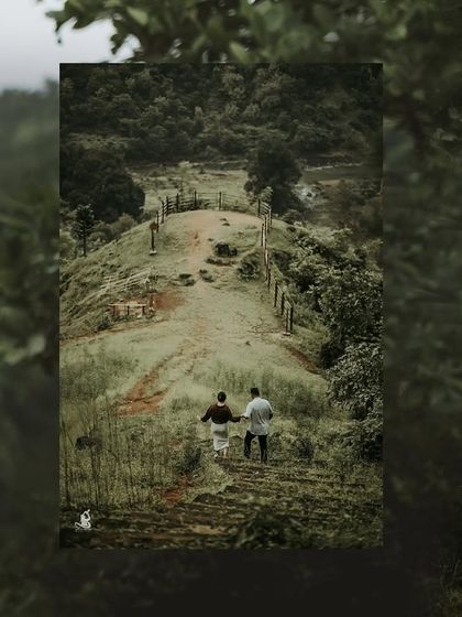 A couple walking down a scenic path together, a symbolic shot of their journey ahead, captured from above.