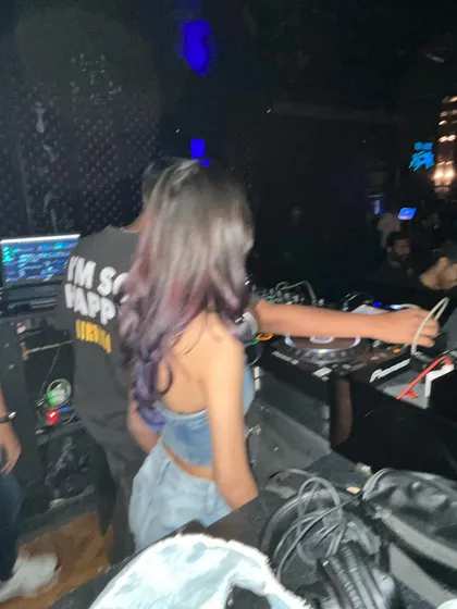 A behind-the-scenes look at the DJ booth. You can see the complex setup of wires and my Pioneer gear that I use to mix my sets.