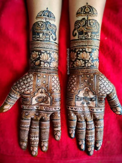 I love blending traditional symbols into my designs. This custom bridal mehndi features majestic elephants under ceremonial umbrellas, along with the couple's names, Harsh and Payal, woven into the pattern.