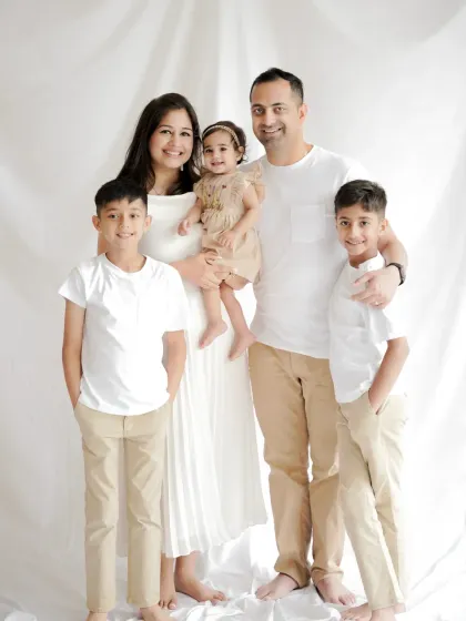 A simple, classic family portrait is a treasure. We photographed this beautiful family of five in our studio, using clean, bright lighting to focus on their happy connection and create a perfect family picture.