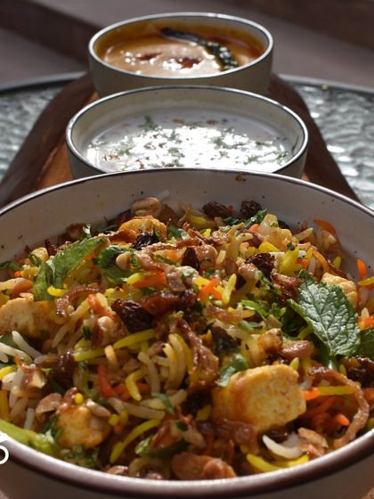 This close-up of my Nizami Tarkari Pulao shows the colorful mix of rice, vegetables, and herbs. It's an entire meal in itself, spiced to perfection.