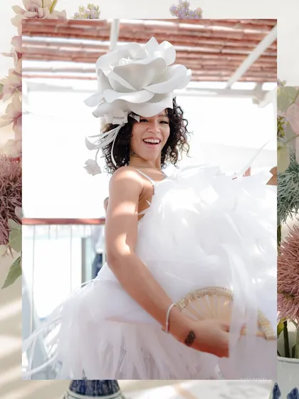 Whimsical and bold. This bride's look for her derby-themed event was all about making a statement. I styled her with a giant white rose headpiece and a playful feather dress, a look that is both fun and high-fashion.