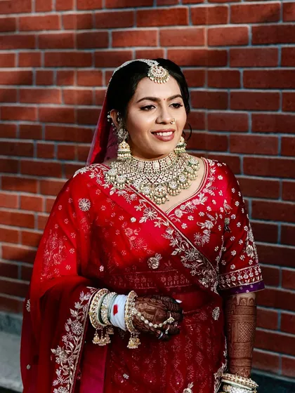A beautiful candid of the bride. Her glowing skin and soft smile are the highlights of this traditional look.